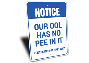 Our Pool Has No Pee In It Sign Wood Background Left Side View